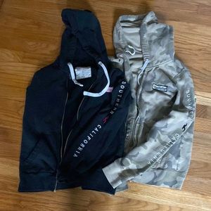 Lot of 2 Hollister hoodies in camo and black. Size XS.